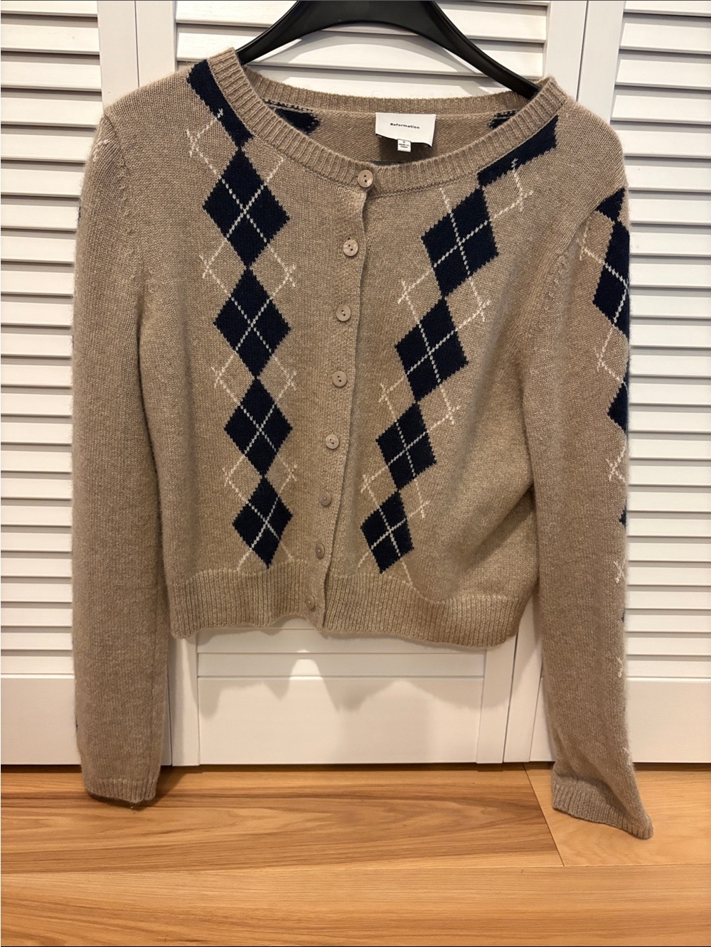 Reformation Beige Cardigan with Navy Argyle Pattern